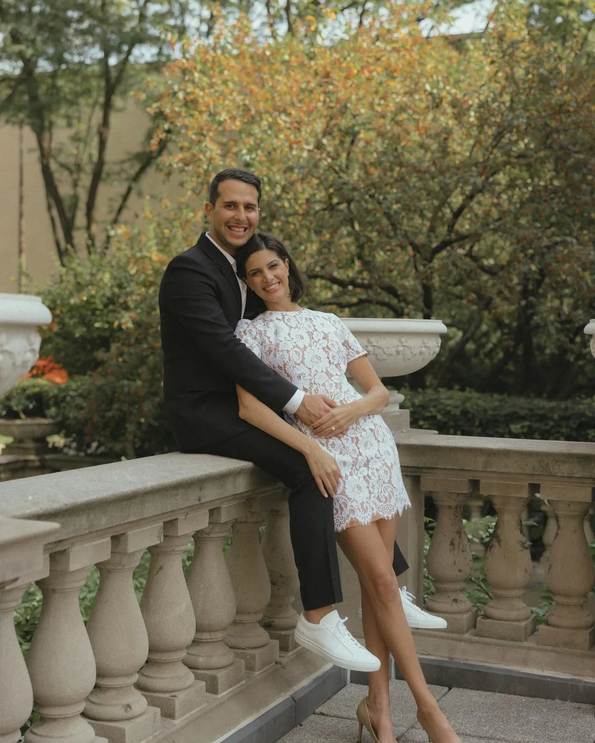Omar Mourad and his fiancée on a stone terrace in Windsor, her Joseph-Anthony engagement ring on her hand